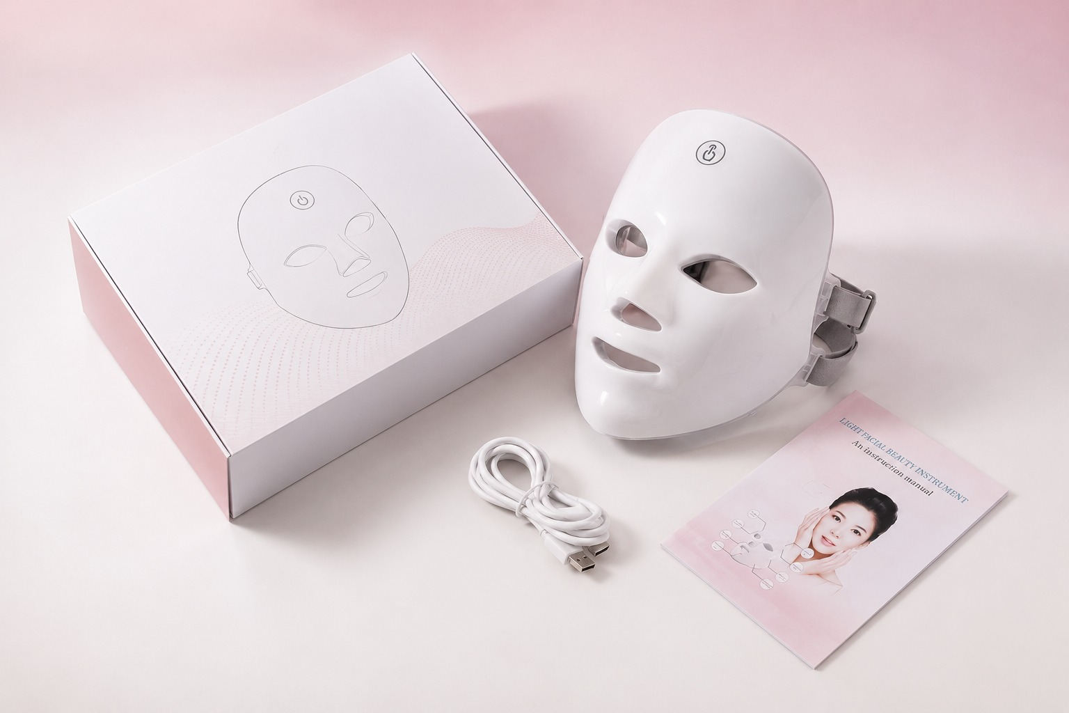 Wireless LED face mask with its box, USB cable and manual